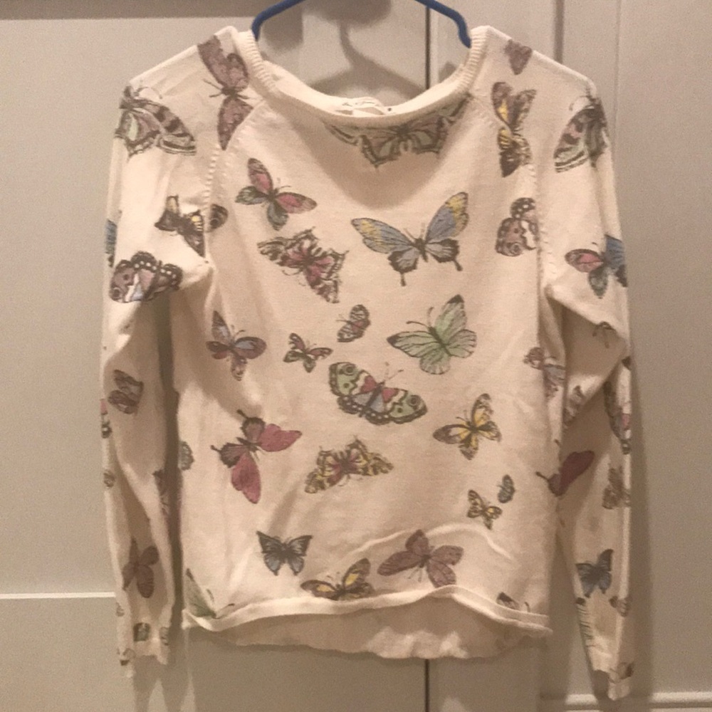 A butterfly cream sweater